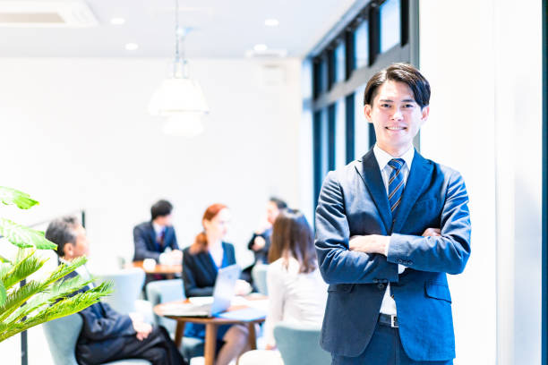istock Businessman with a smile and crossed arms 1387779356