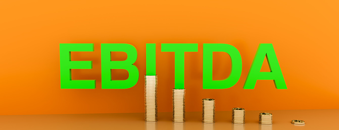 EBITDA word built with letter and stacked coins. 3d rendering