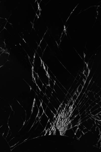 istock cracks on the broken smartphone screen close-up. Vertical framing option 1387782882