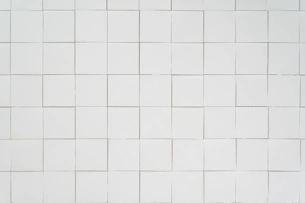 istock a white textured wall made of three-dimensional square segments. 1387782954
