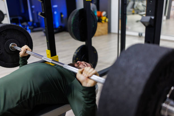 istock Bench pressing in the gym 1387790385