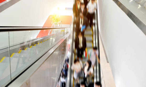 istock business people on the escalator 1387792227