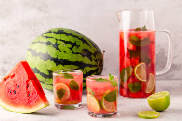istock Fresh tasty delicious watermelon lemonade on a light background 1387792309