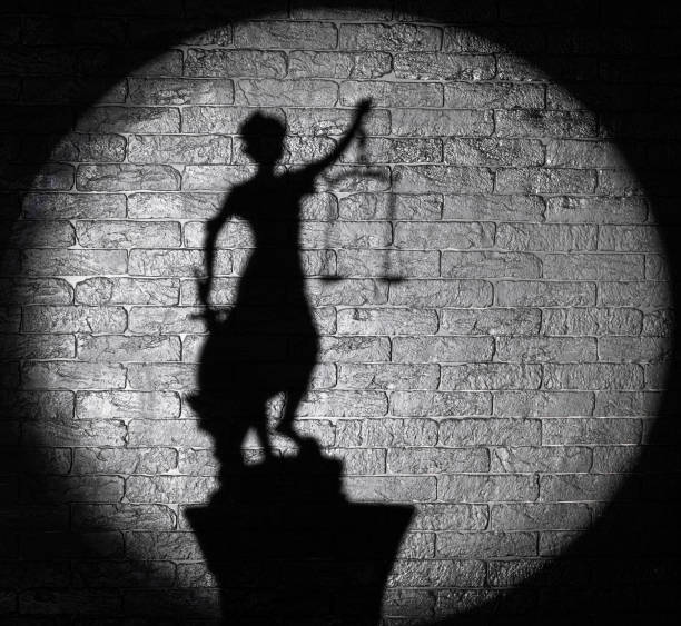 istock shadow of the goddess Themis on a black background 1387793509