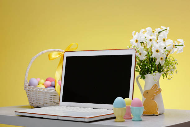 istock A laptop with a blank screen on a table festively decorated for the Easter holiday 1387794691