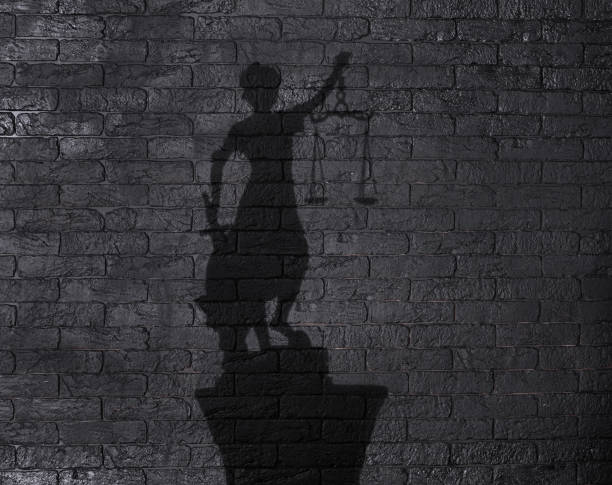 istock shadow of the goddess Themis on a black background 1387794913