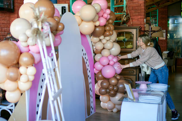 istock Young party planner arranging party decoration 1387799226