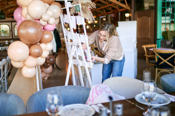 istock Young party planner arranging party decoration 1387799227