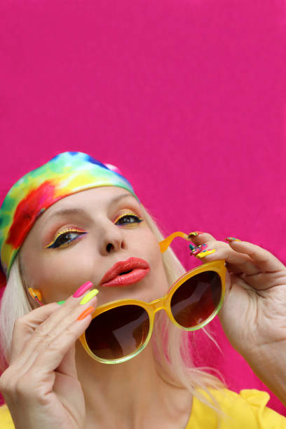 istock A model in a headscarf with a multicolored manicure . 1387801995