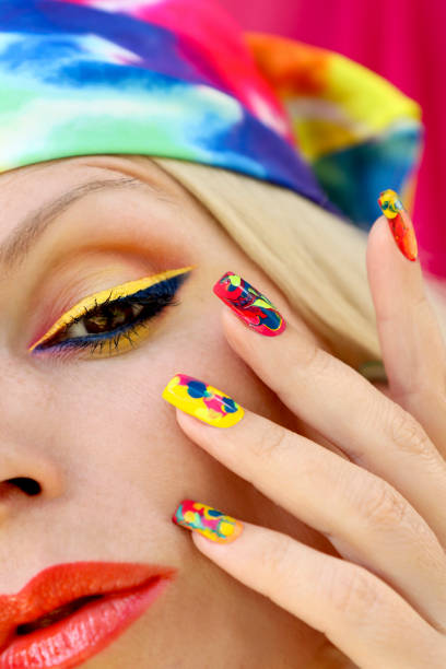 istock A model in a headscarf with a multicolored manicure . 1387801996