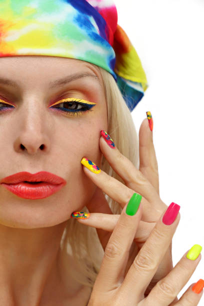 istock A model in a headscarf with a multicolored manicure . 1387802002
