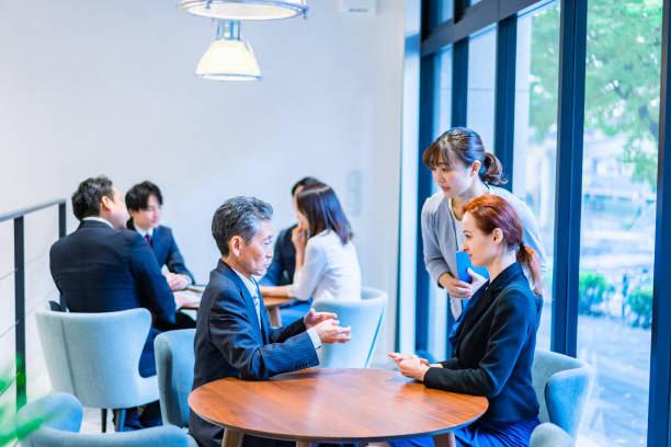 istock Business people talking in an office 1387802506