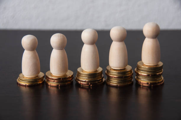 istock Coins Stack with wooden doll model - Business Concept 1387803270