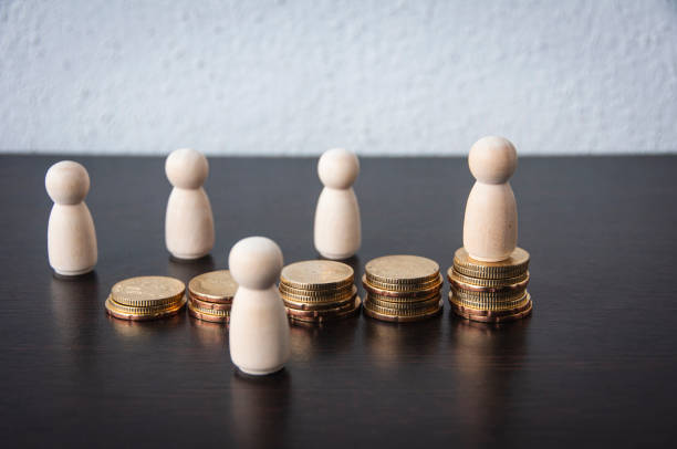 istock Coins Stack with wooden doll model background - Business Concept 1387803306