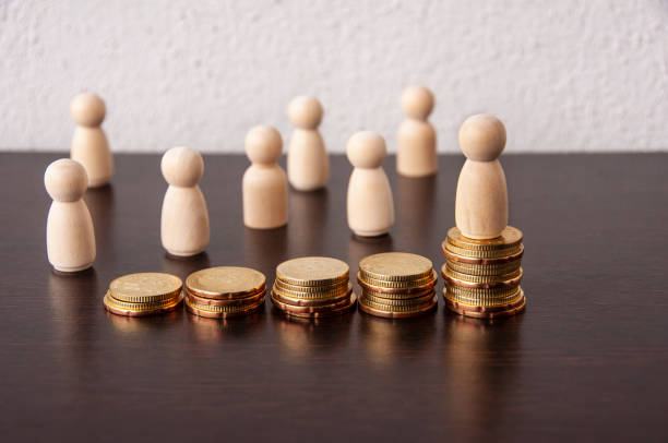 istock Coins Stack with wooden doll model background - Business Concept 1387803494