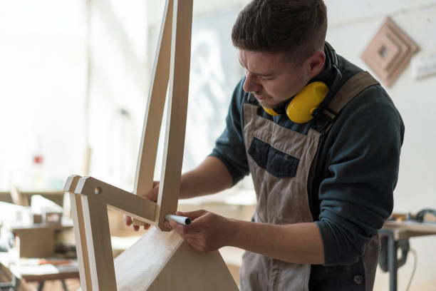 istock Young crafts man working in his atelier 1387804278