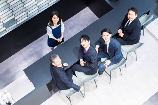 istock Businessman talking in the office cafeteria 1387804309