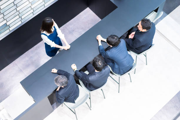 istock Businessman talking in the office cafeteria 1387804313