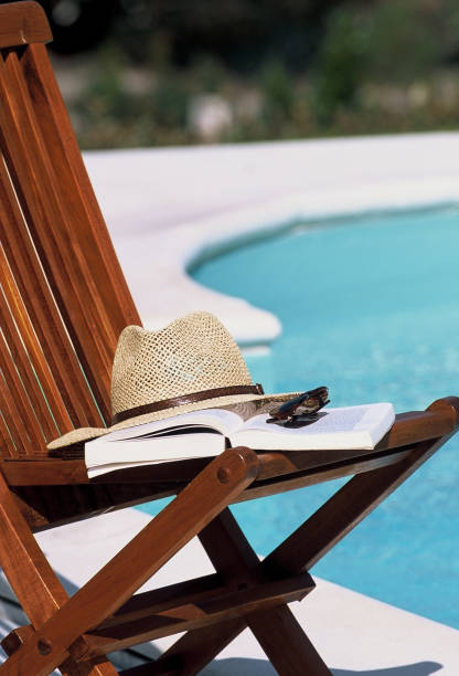 istock Garden chair and book 1387805562