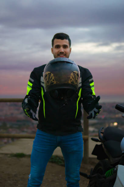 istock A hispanic man standing on a viewpoint at the sunset making it look like it is levitating a helmet 1387805615