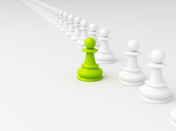 Single green pawn, standing out from the crowd. Business strategy concept background