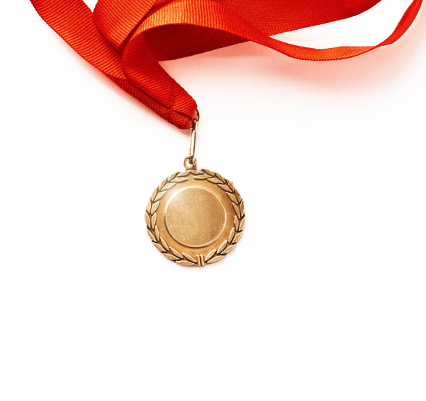 Metal medal with laurel leaves represents the honor of winning.