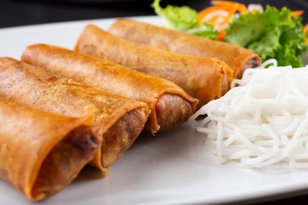 egg rolls on a plate stock photo