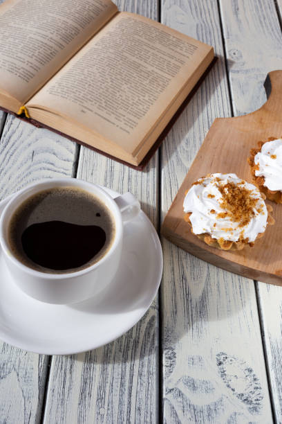 istock breakfast with cupcakes and coffee on a white wooden table 1387809316