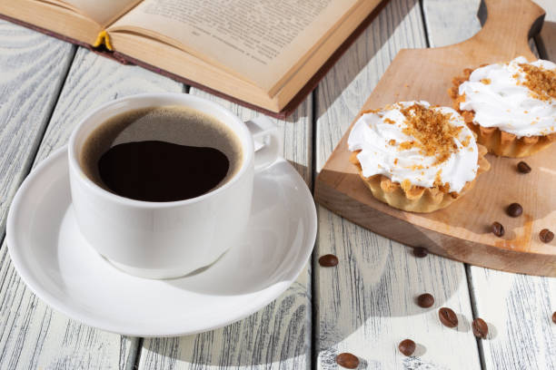 istock breakfast with cupcakes and coffee on a white wooden table 1387809336