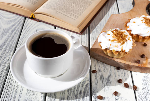 istock breakfast with cakes and coffee on a white wooden table. Spring breakfast. 1387809862