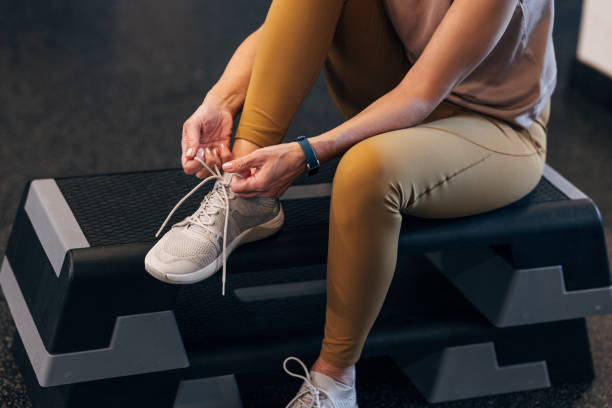 istock An Unrecognizable Woman Sitting And Tying Her Shoelace Before Her Workout 1387811590