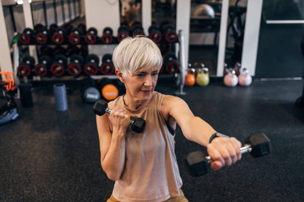 istock A Determined Senior Woman Doing Exercises With Dumbbells While Looking Away 1387811595