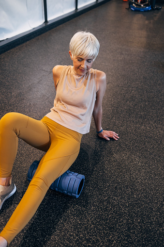 A beautiful female exercising regularly in the gym to keep fit.