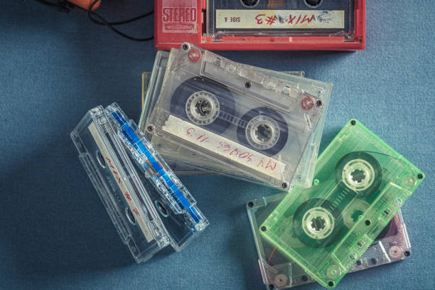 istock Classic cassette tape with red player and headphones. 1387812259