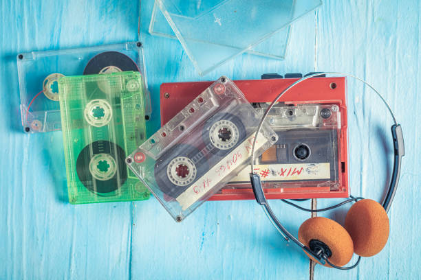 istock Vintage audio cassette with red player and headphones. 1387812872