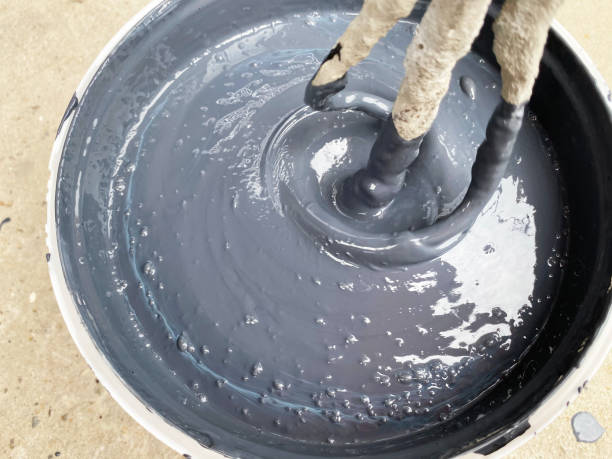 istock Building mixer for mixing paint. Mixing process 1387814641
