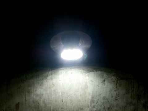 lamp light illuminates a dark room