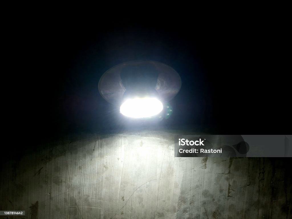 lamp light illuminates a dark room Bright Stock Photo