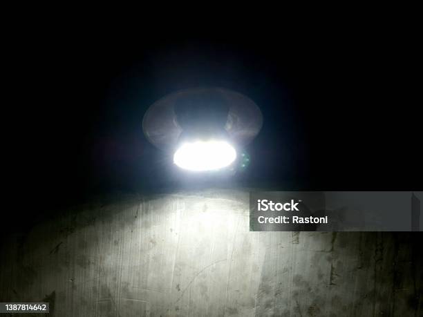 Lamp Light Illuminates A Dark Room Stock Photo - Download Image Now - Bright, Darkroom, Backgrounds