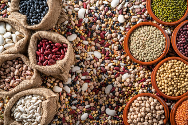 istock Assorted legumes in burlap sacks with varied mix in background 1387814892