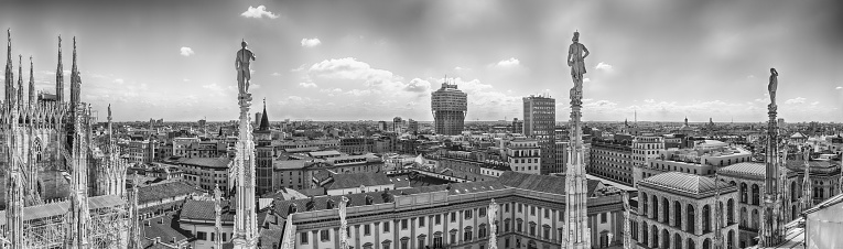 Panoramic aerial view over the city centre, as seen from the roof of the gothic Cathedral, Milan, Italy