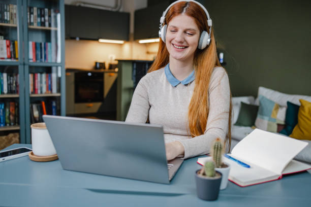 istock Woman working in her home office 1387818083