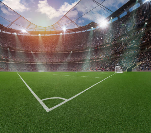 textured free soccer field in the evening light - corner stock photo