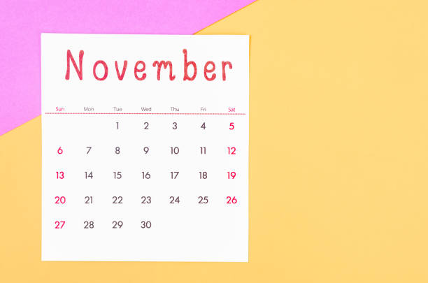 november 2022 calendar on multicolored background. - november calendar pink event imagens e fotografias de stock