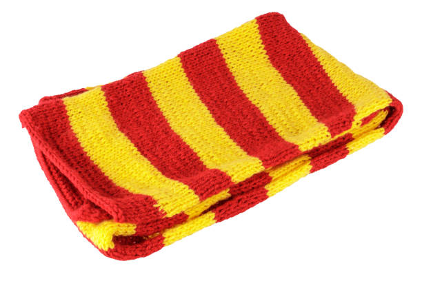 istock folded red-yellow striped wool scarf isolated on white background 1387821097