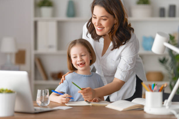 istock Girl doing homework or online education. 1387821119