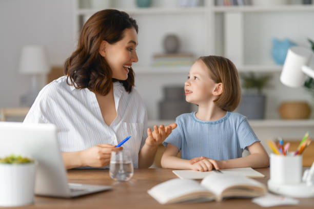 istock Girl doing homework or online education. 1387821120