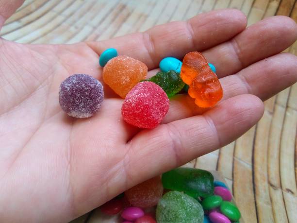 gummy candy Colorful Candy on the hand gum drop photos stock pictures, royalty-free photos & images