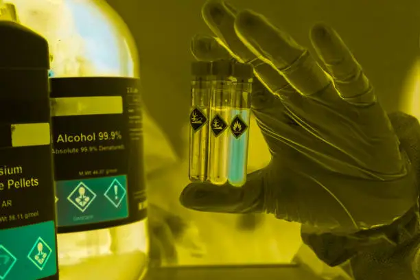 Photo of Chemicals in test tubes and symbols used in laboratory