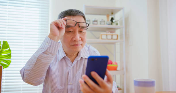 istock elderly man has farsighted 1387831147